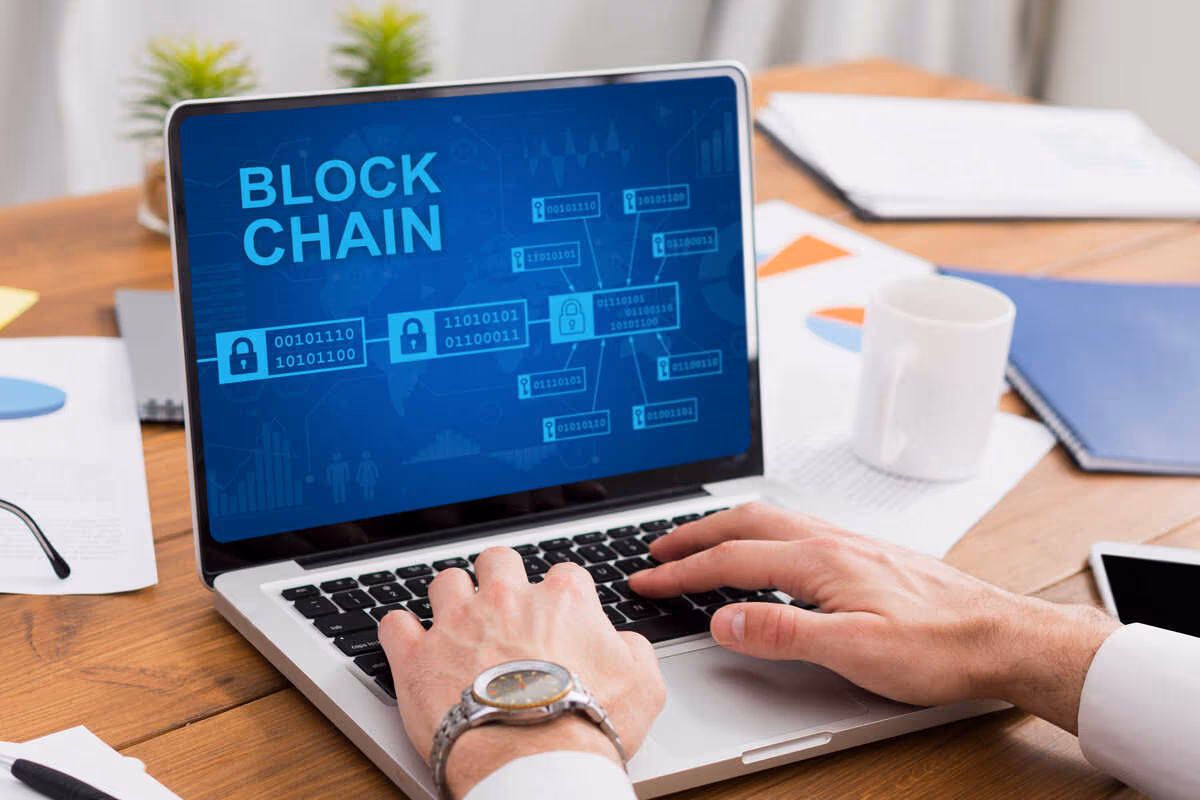 Man working on his laptop using blockchain technology